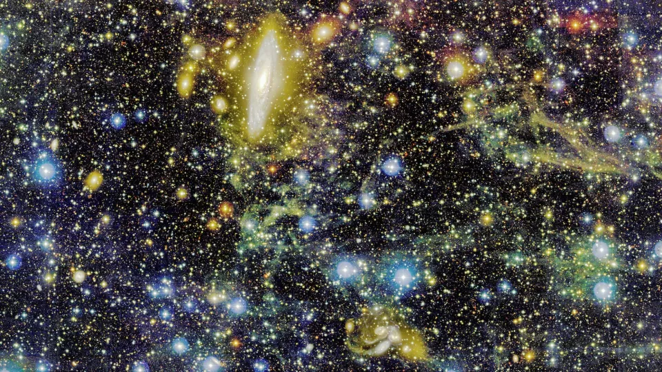 Färgrikt myller av såväl avlägsna galaxer som förgrundsstjärnor i vår egen galax. Stephans kvintett ligger snett ner till höger i bilden. Foto: CFHT, Pierre-Alain Duc (Obs. de Strasbourg) & Jean-Charles Cuillandre (CEA Saclay/Obs. de Paris).