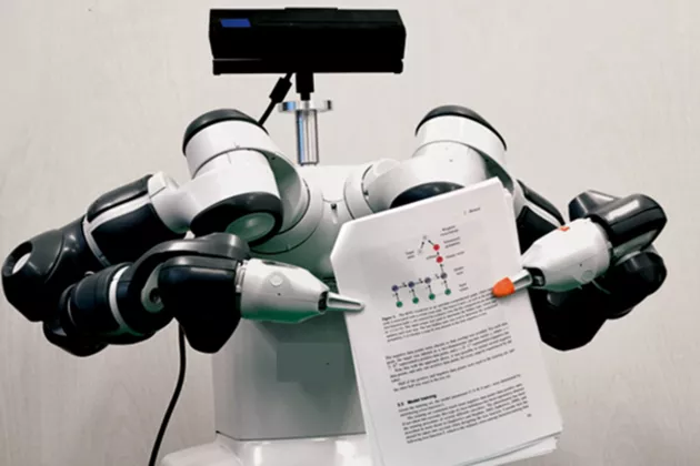 Bilden visar en så kallad samarbetsrobot som i det här fallet har ögon (kameran längst upp) och läser en text. Bild: Martin Karlsson